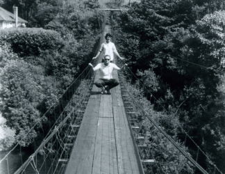 People posing with bridges