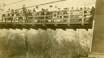 People posing with bridges