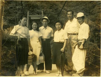 People posing with bridges