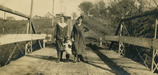 People posing with bridges