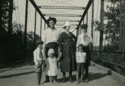 People posing with bridges